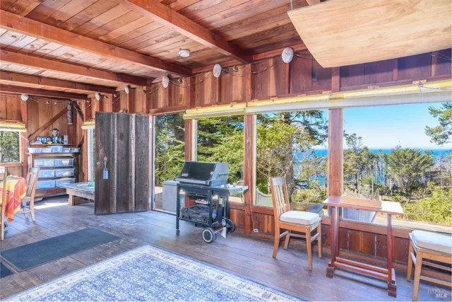 a view of a chairs and table in a patio