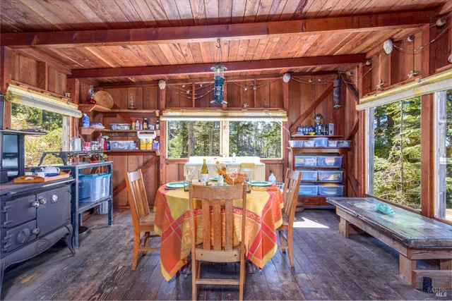 a bedroom with furniture and a rug