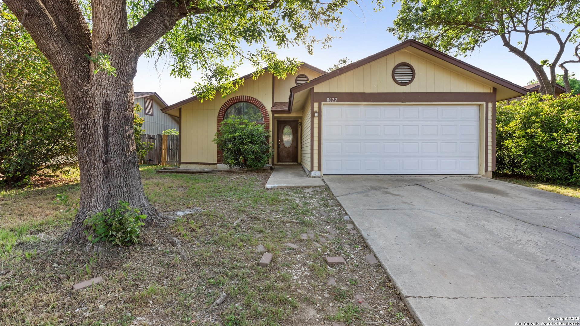 8622 Ridge Flower San Antonio, TX 78239 - Photo 16 of 19 a front view of a house with garden