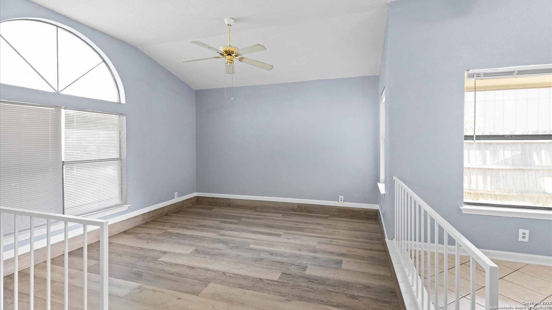 8622 Ridge Flower San Antonio, TX 78239 - Photo 3 of 19 wooden floor in an empty room with a window