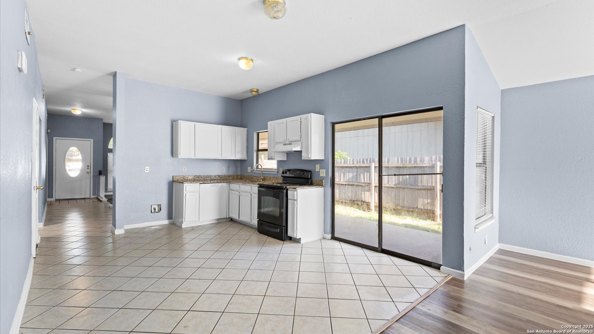 8622 Ridge Flower San Antonio, TX 78239 - Photo 6 of 19 a kitchen with stainless steel appliances a refrigerator sink and cabinets