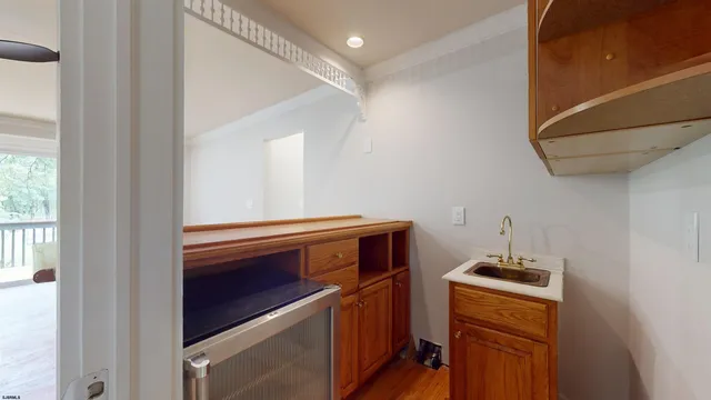 a kitchen with a stove a sink and a microwave