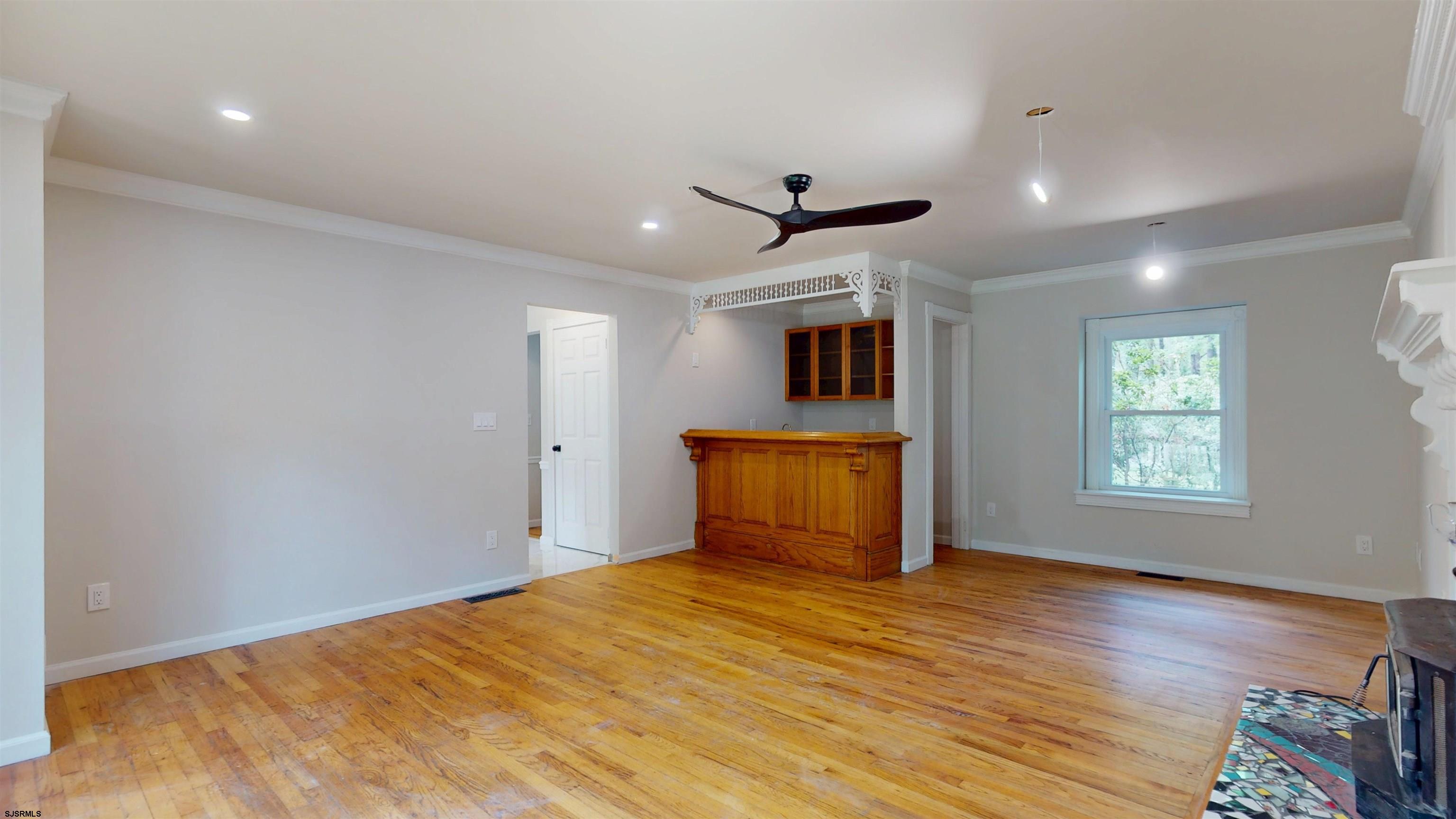 254 West Cologne Port Republic Road Egg Harbor City, NJ 08215 - Photo 13 of 81 a view of empty room with wooden floor and fan