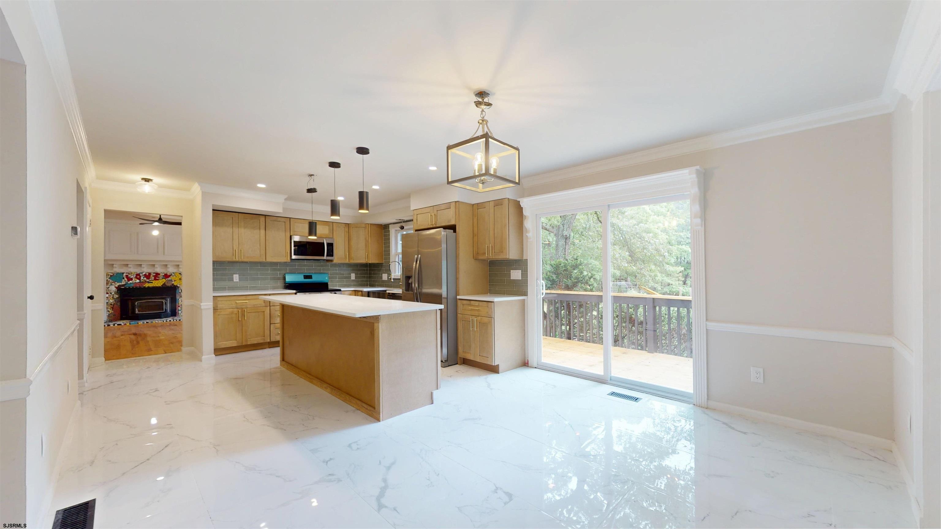 254 West Cologne Port Republic Road Egg Harbor City, NJ 08215 - Photo 15 of 81 a large kitchen with kitchen island a large counter and stainless steel appliances