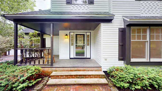 a view of a house with porch and wooden floor
