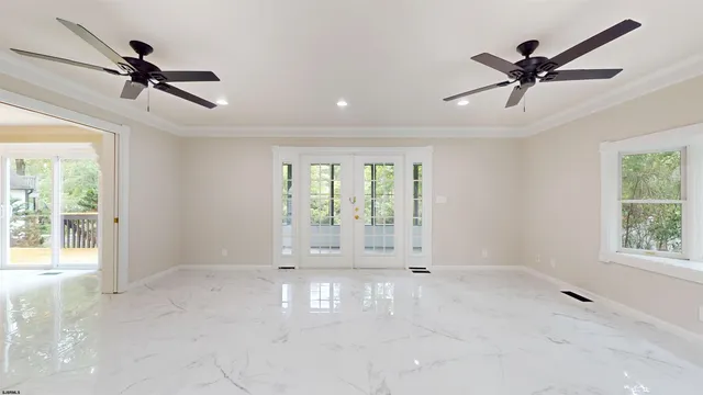 a view of an empty room with a window