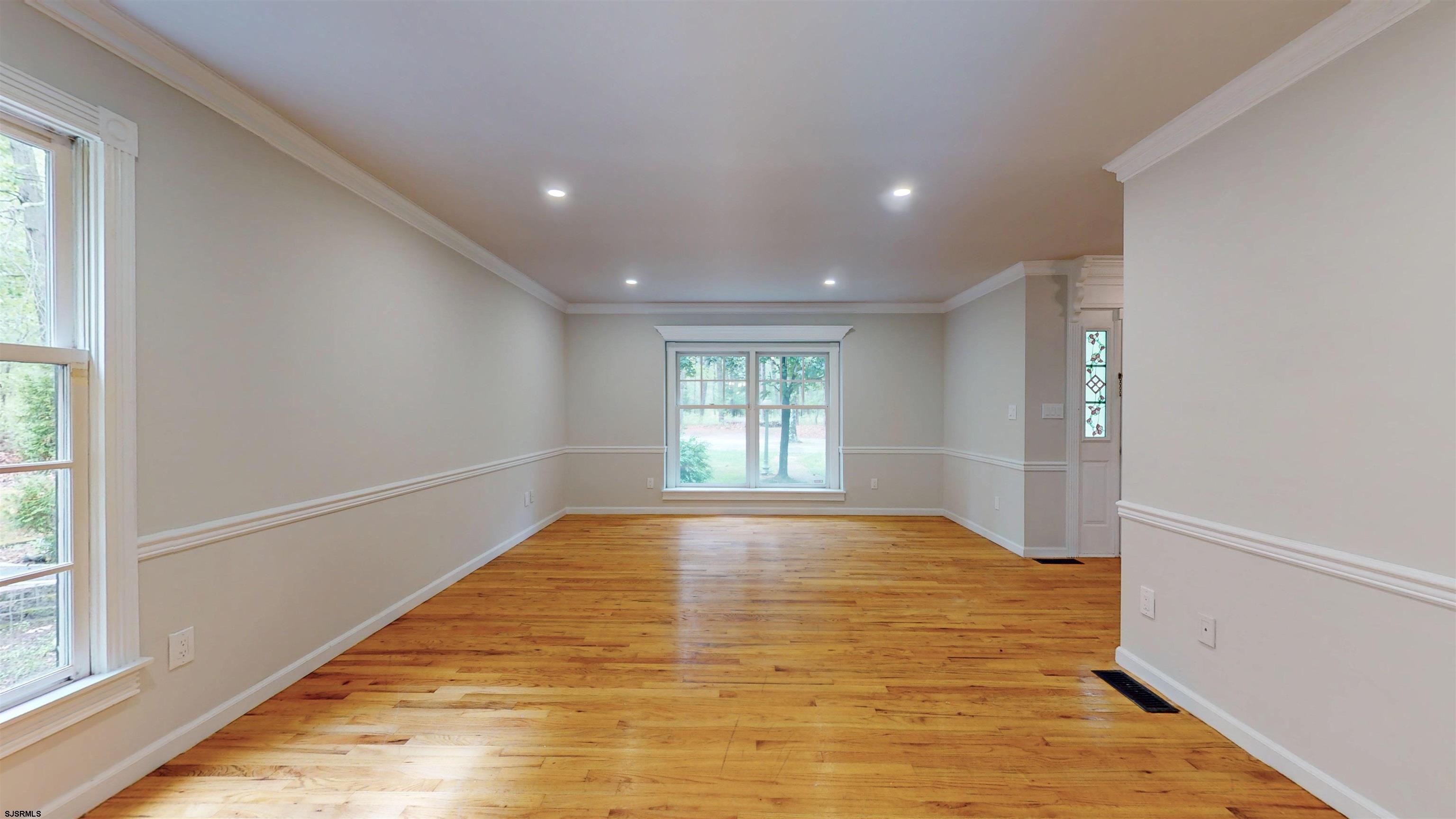 254 West Cologne Port Republic Road Egg Harbor City, NJ 08215 - Photo 28 of 81 a view of empty room with wooden floor and fan