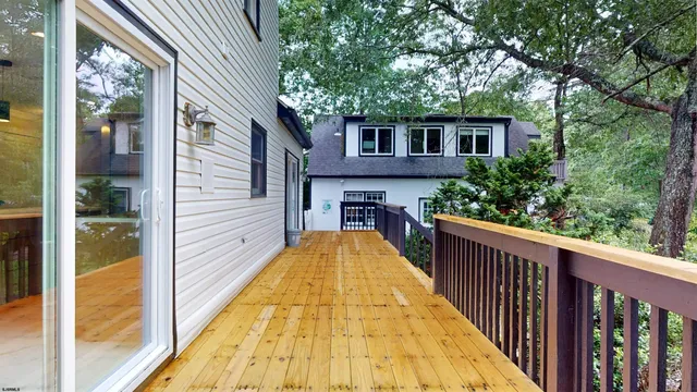 a bathroom with a sink a toilet and a window