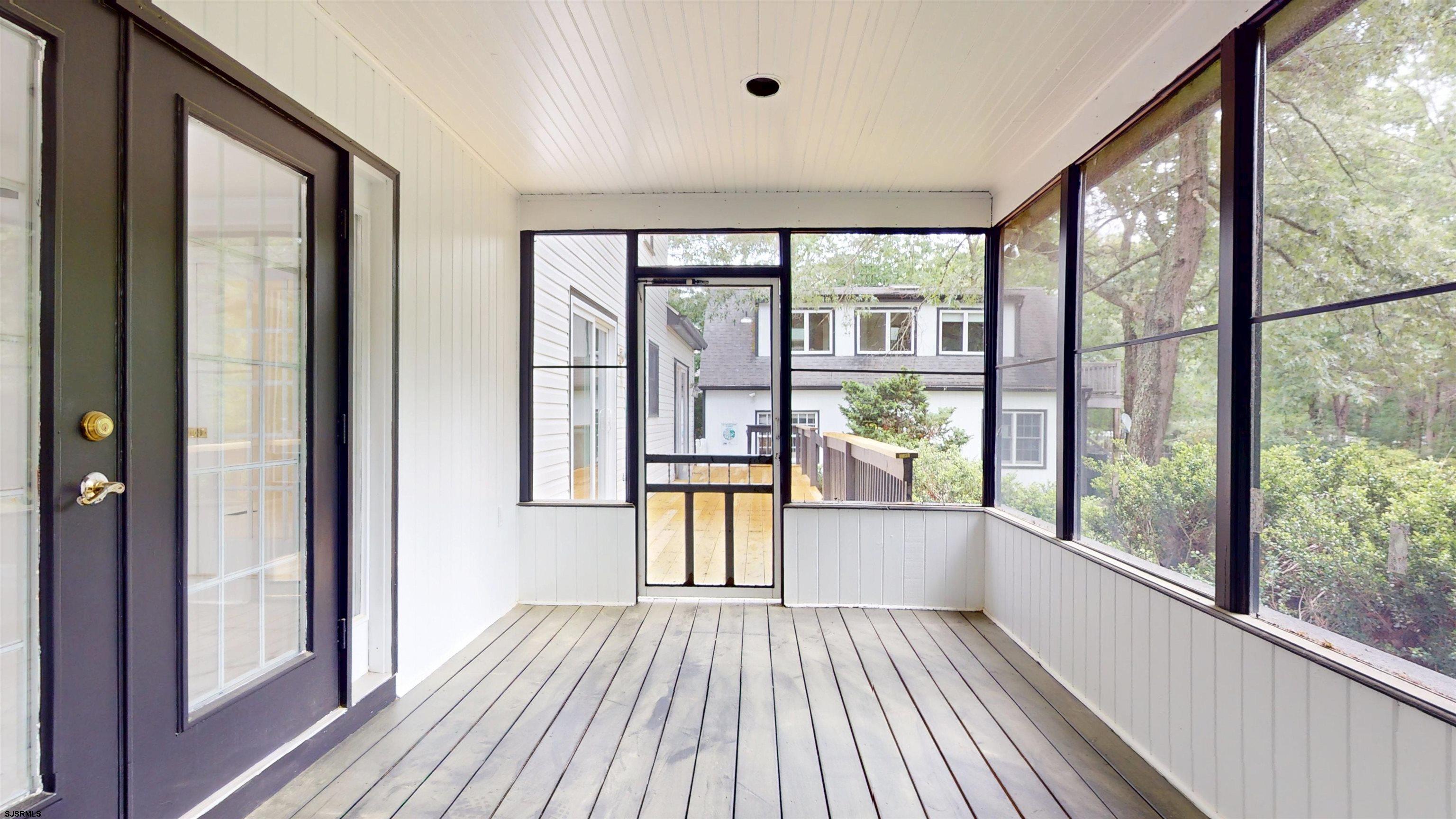 254 West Cologne Port Republic Road Egg Harbor City, NJ 08215 - Photo 33 of 81 a view of an empty room with a window and wooden floor