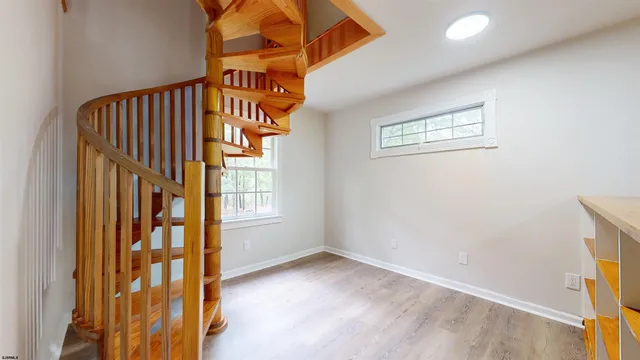 a view of entryway with wooden floor