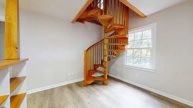 a view of entryway with wooden floor