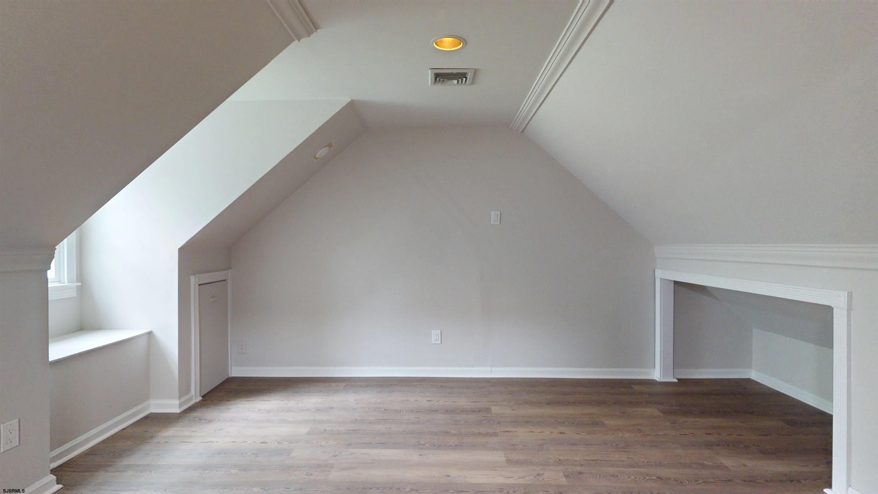 254 West Cologne Port Republic Road Egg Harbor City, NJ 08215 - Photo 47 of 81 a view of an empty room with wooden floor and windows
