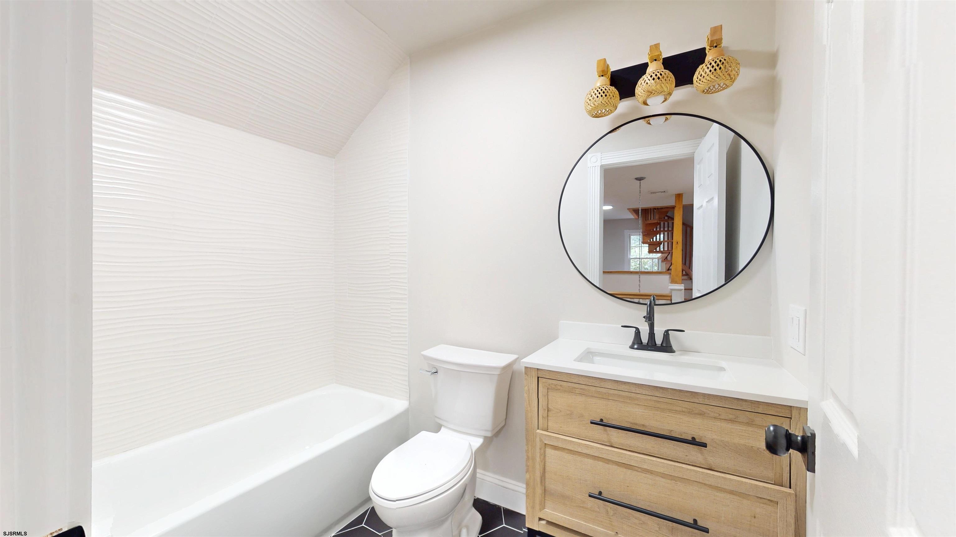 254 West Cologne Port Republic Road Egg Harbor City, NJ 08215 - Photo 51 of 81 a bathroom with a toilet sink and mirror