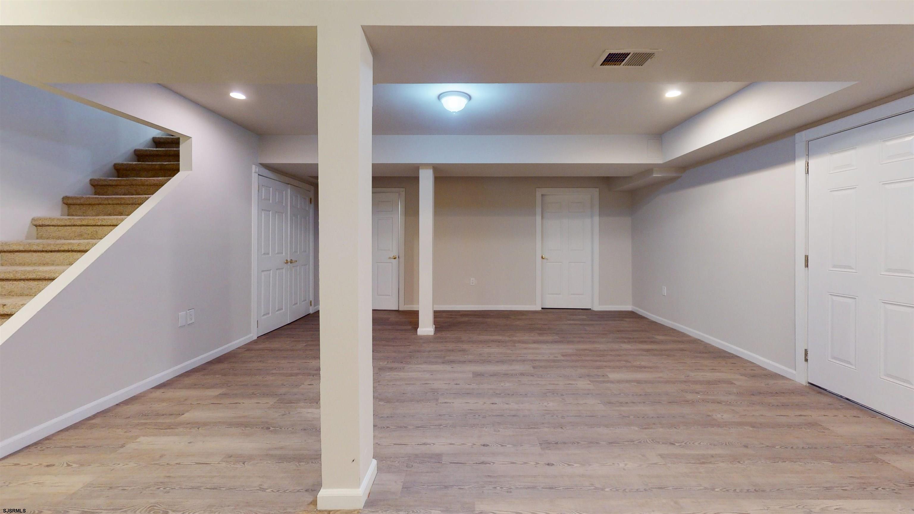 254 West Cologne Port Republic Road Egg Harbor City, NJ 08215 - Photo 57 of 81 a view of an empty room with wooden floor