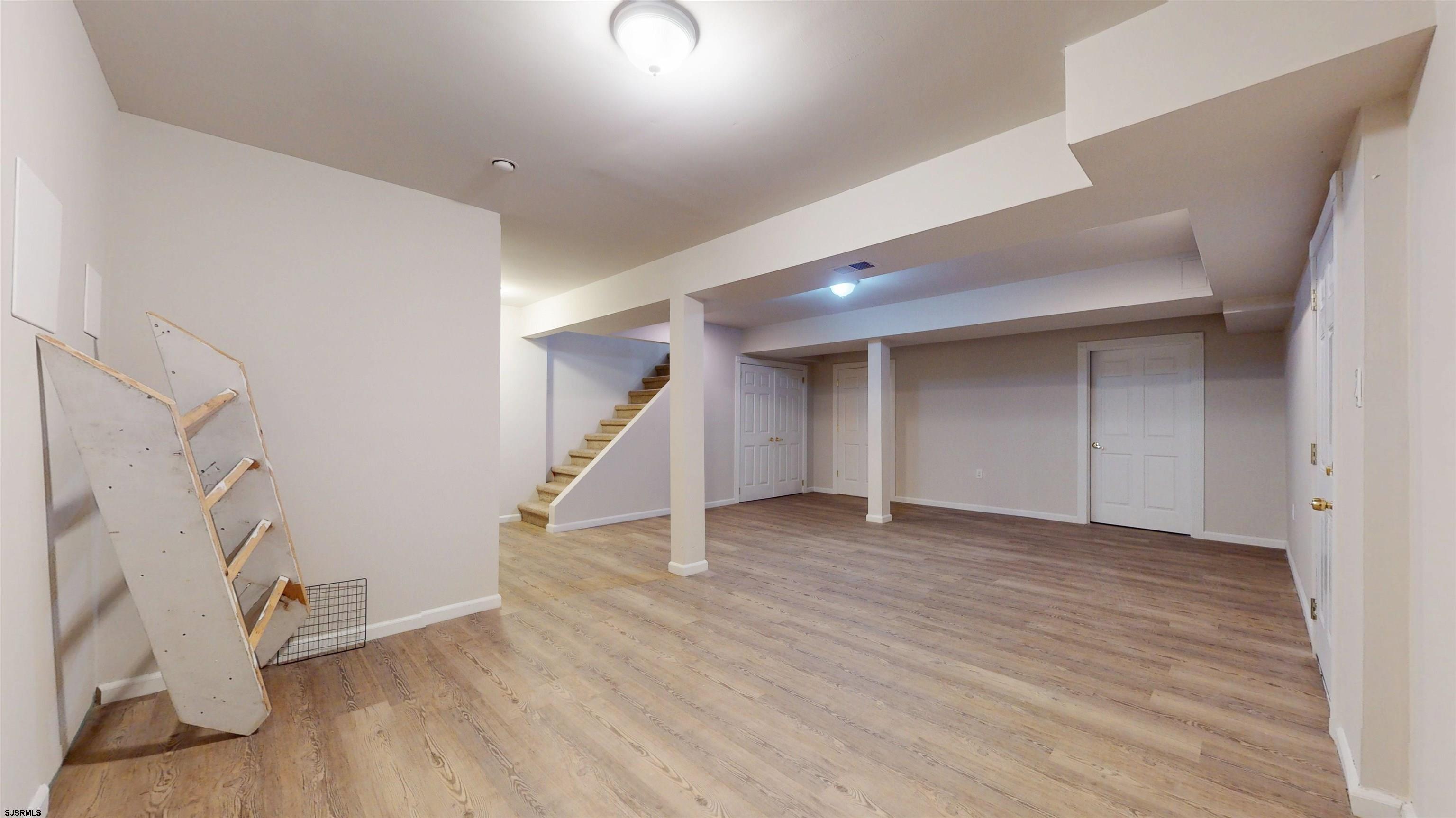 254 West Cologne Port Republic Road Egg Harbor City, NJ 08215 - Photo 58 of 81 a view of an empty room with wooden floor and a window