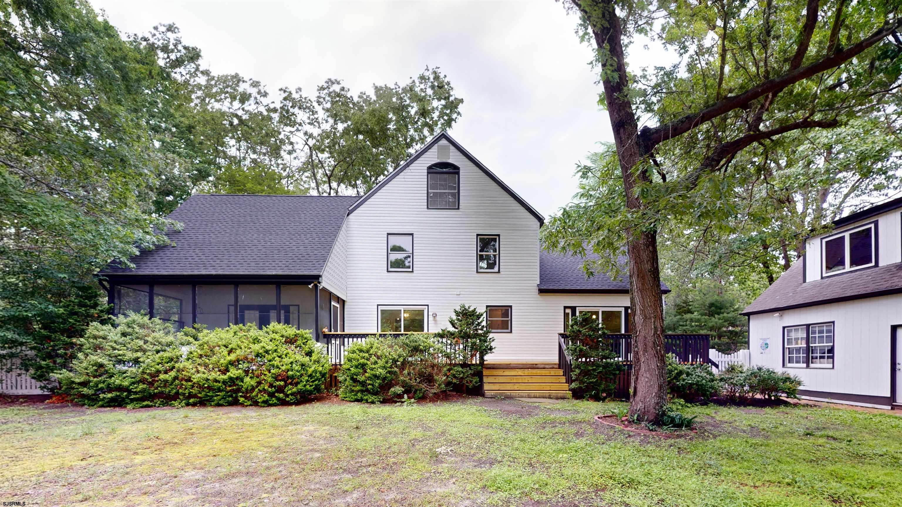 254 West Cologne Port Republic Road Egg Harbor City, NJ 08215 - Photo 66 of 81 a front view of a house with a yard and potted plants