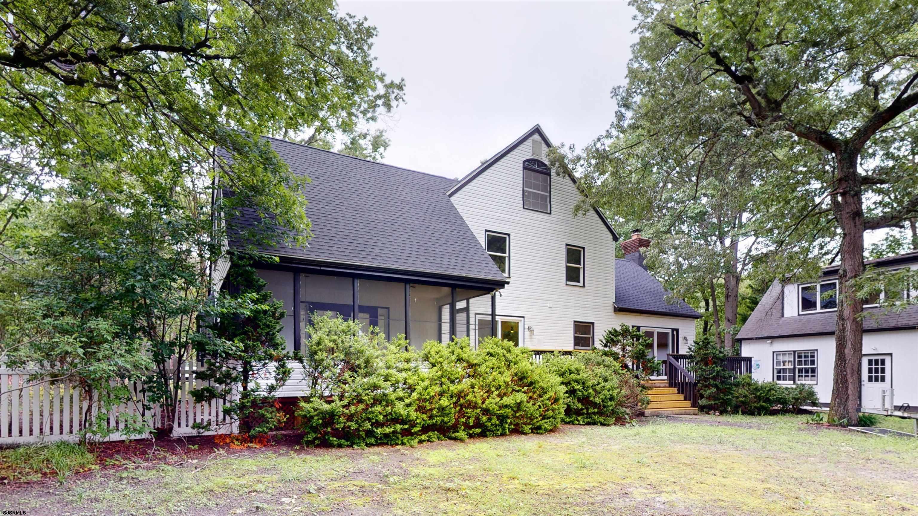 254 West Cologne Port Republic Road Egg Harbor City, NJ 08215 - Photo 67 of 81 a front view of a house with a yard and potted plants