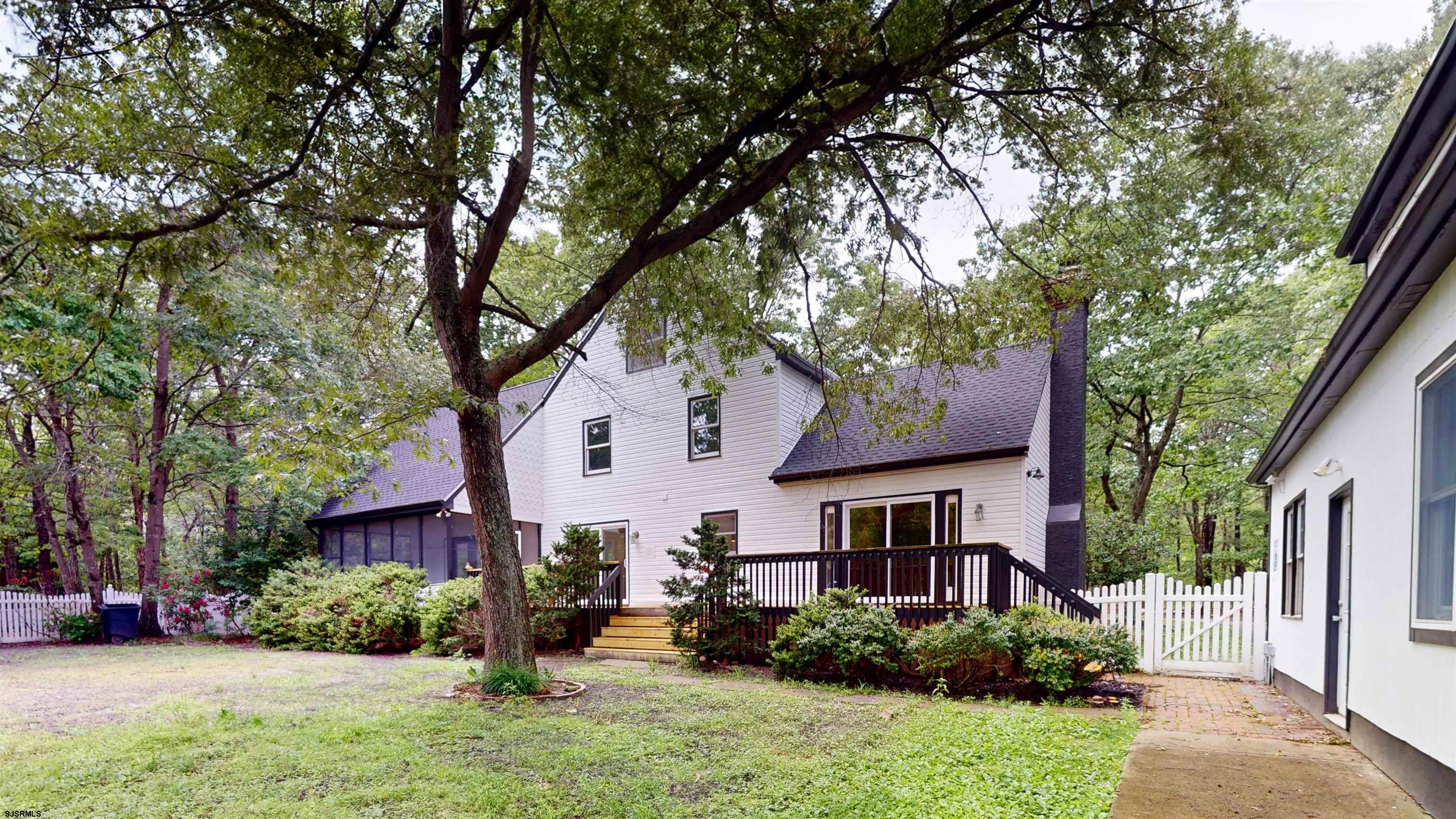 254 West Cologne Port Republic Road Egg Harbor City, NJ 08215 - Photo 69 of 81 a front view of a house with a yard and potted plants