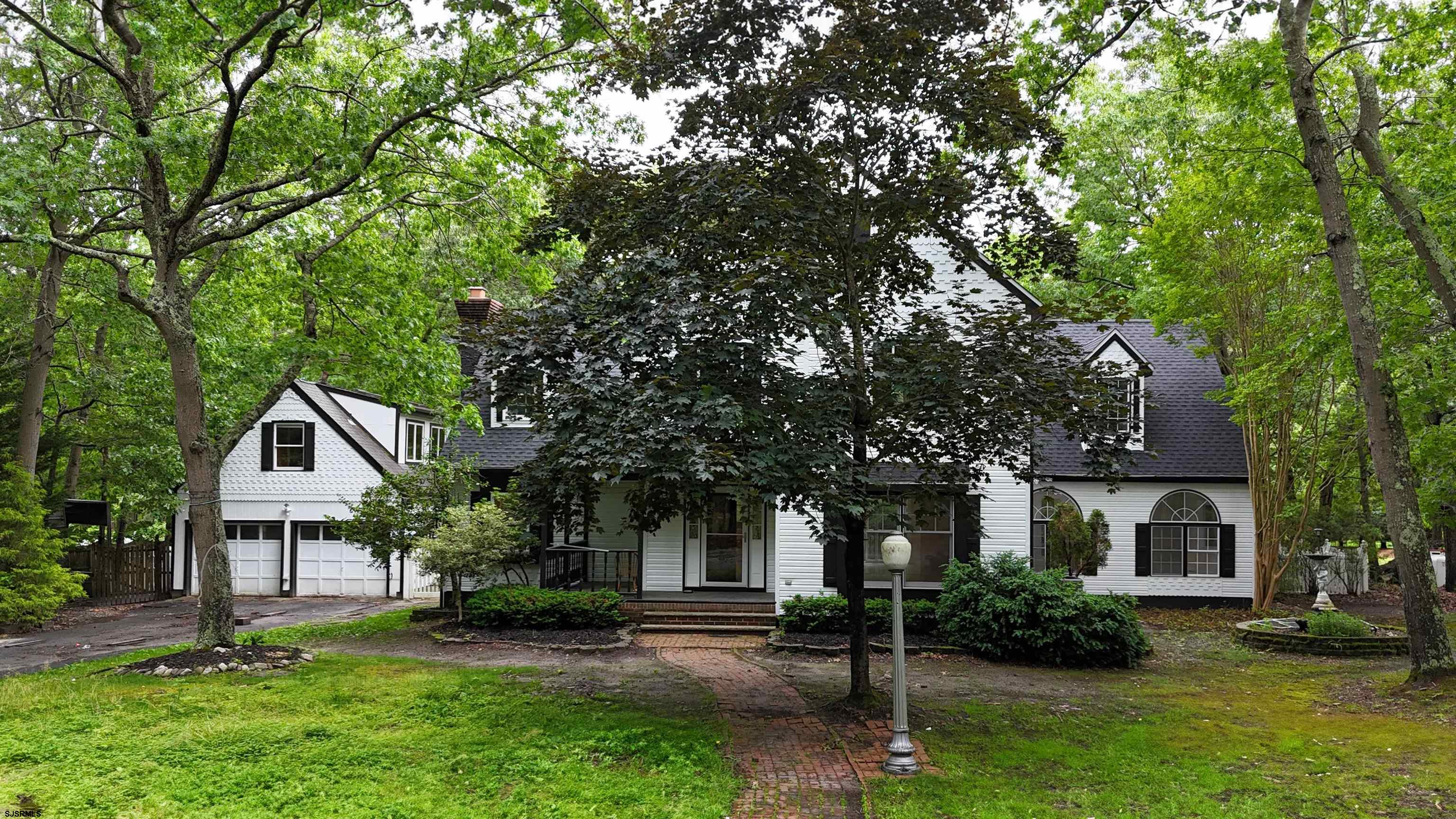 254 West Cologne Port Republic Road Egg Harbor City, NJ 08215 - Photo 71 of 81 a front view of a house with a yard and garage