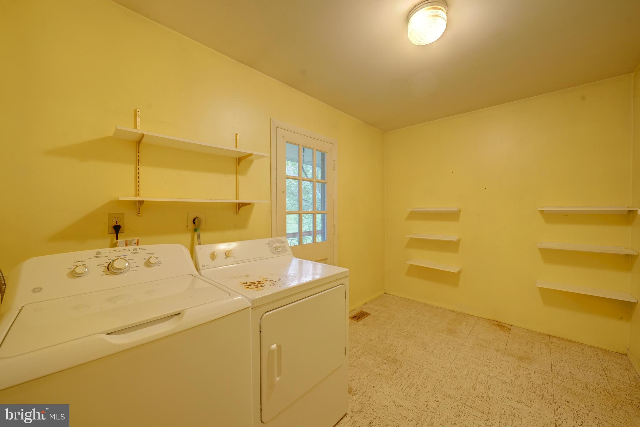 12310 Shadetree Lane Laurel, MD 20708 - Photo 22 of 54 Laundry/mud room with shelves