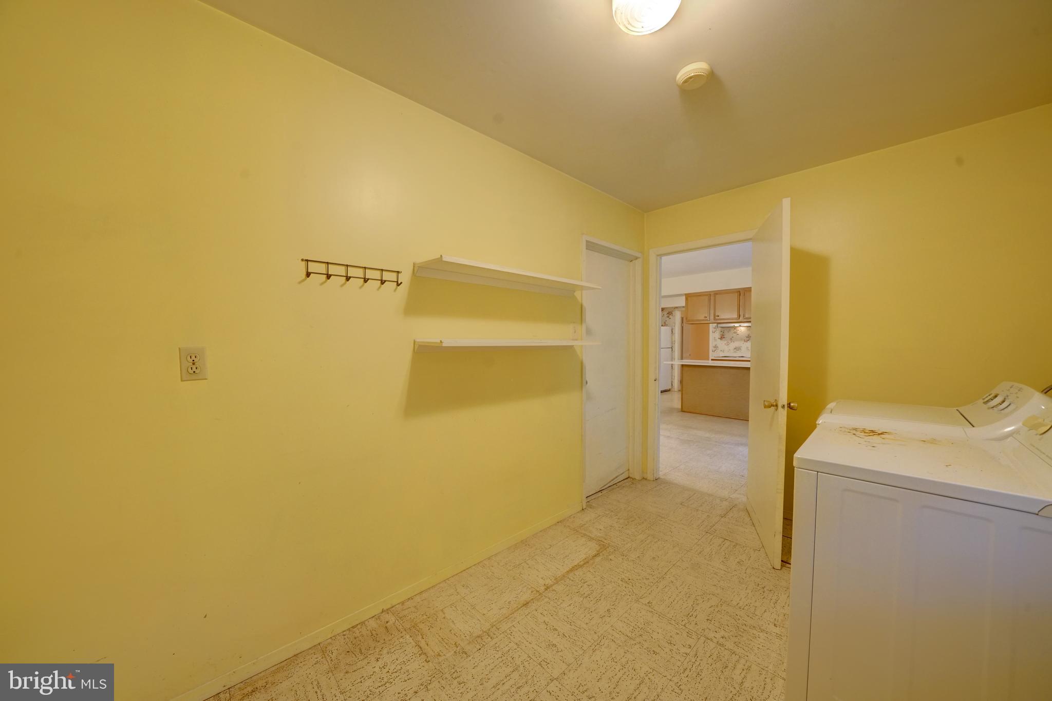 12310 Shadetree Lane Laurel, MD 20708 - Photo 24 of 54 Laundry mud room leads to 2 car garage