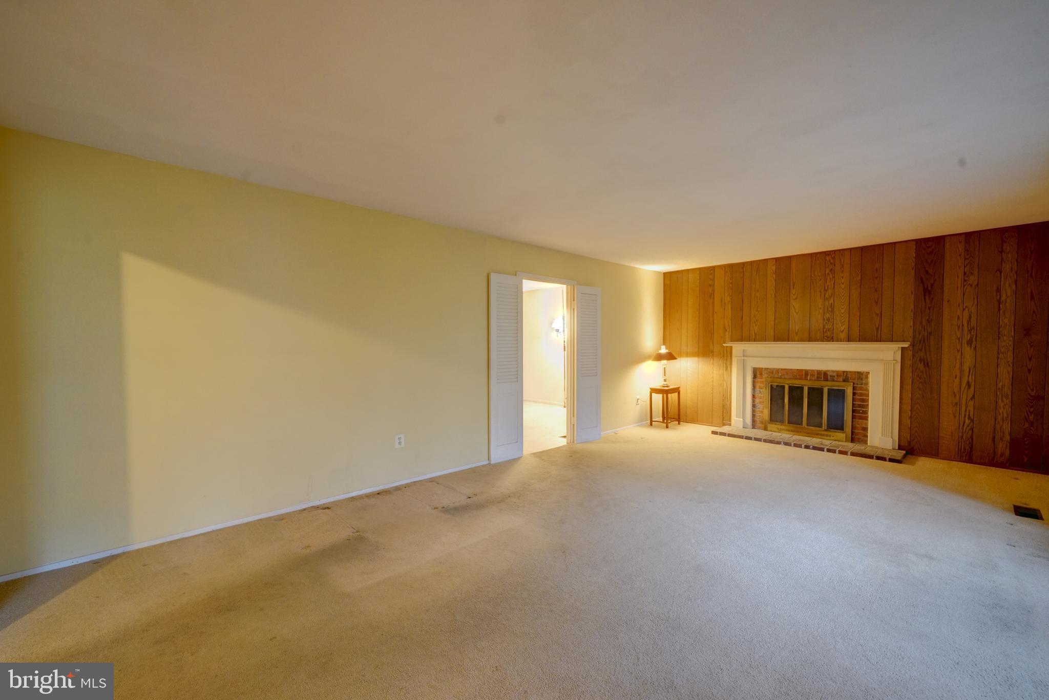 12310 Shadetree Lane Laurel, MD 20708 - Photo 6 of 54 Living room with wood burning fireplace