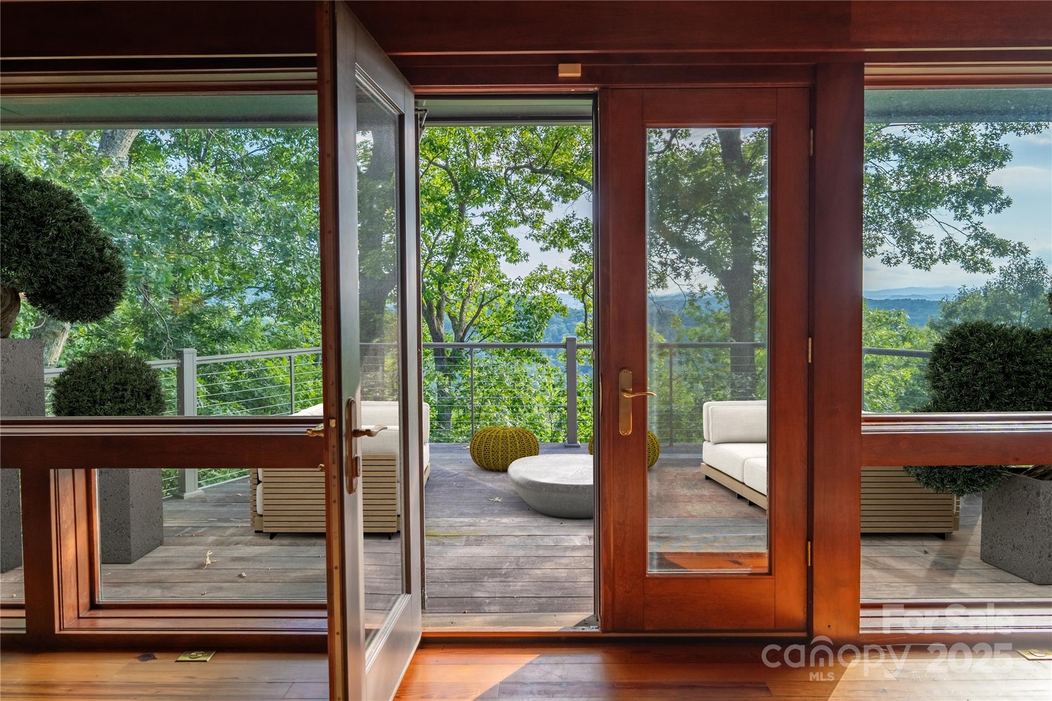 130 Piney Rdg Lane Saluda, NC 28773 - Photo 14 of 48 a view of a porch with wooden floor and a yard
