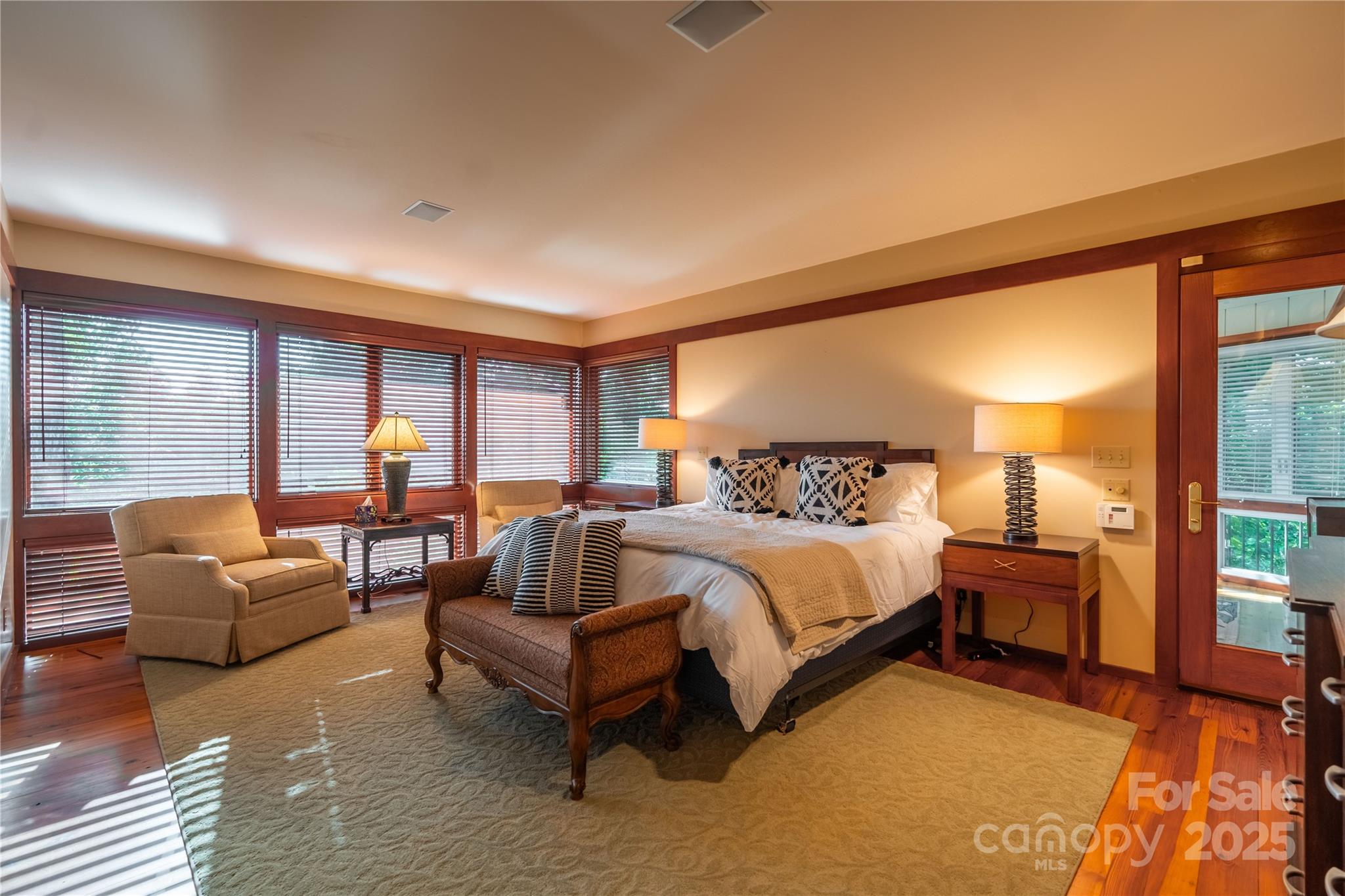 130 Piney Rdg Lane Saluda, NC 28773 - Photo 28 of 48 a spacious bedroom with a bed and glass door