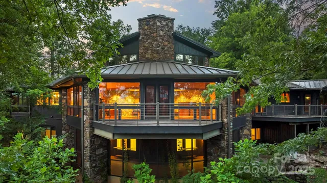 a front view of a house with large windows