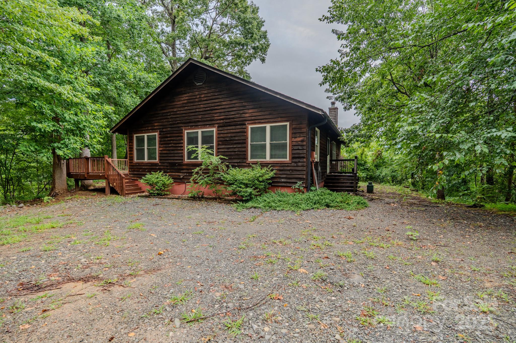 130 Piney Rdg Lane Saluda, NC 28773 - Photo 40 of 48 a view of a house with backyard and garden