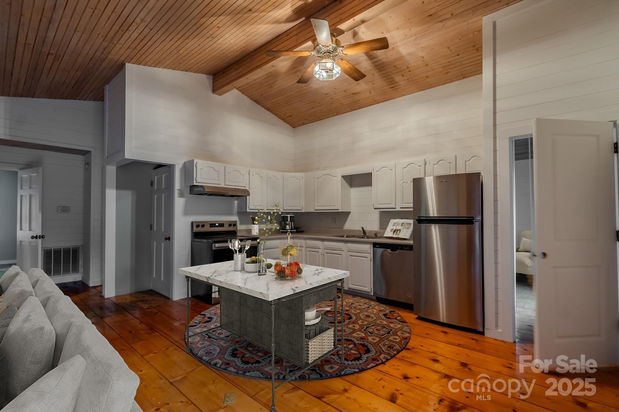 130 Piney Rdg Lane Saluda, NC 28773 - Photo 42 of 48 a kitchen with a appliances a refrigerator and a stove