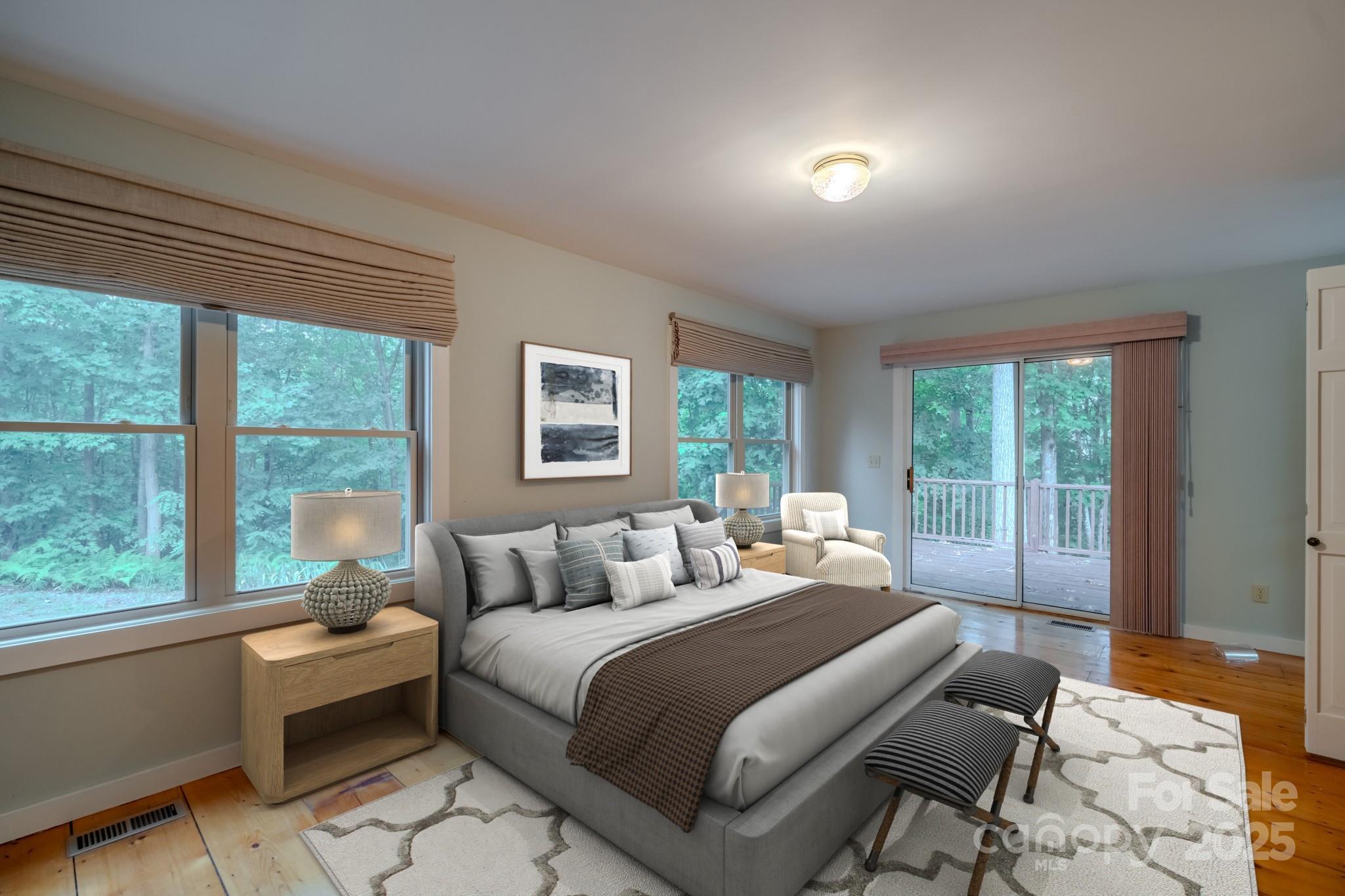 130 Piney Rdg Lane Saluda, NC 28773 - Photo 43 of 48 a bedroom with a bed and glass window