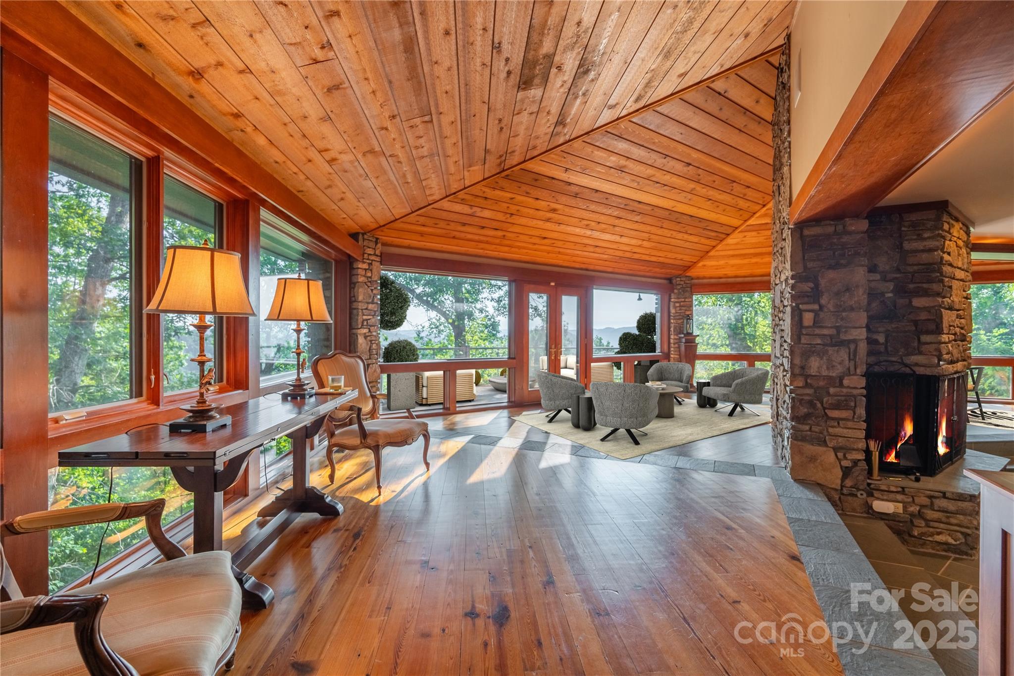 130 Piney Rdg Lane Saluda, NC 28773 - Photo 9 of 48 a living room with furniture a fireplace a wooden floor and next to a window