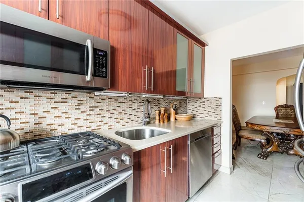 a kitchen with a stove and a microwave
