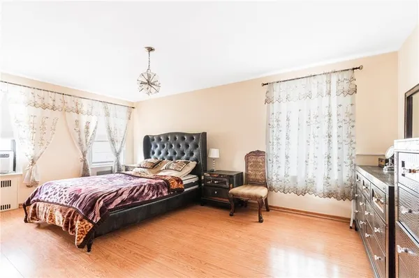 a bedroom with a bed and a chair