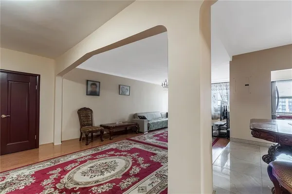 a living room with furniture and a rug