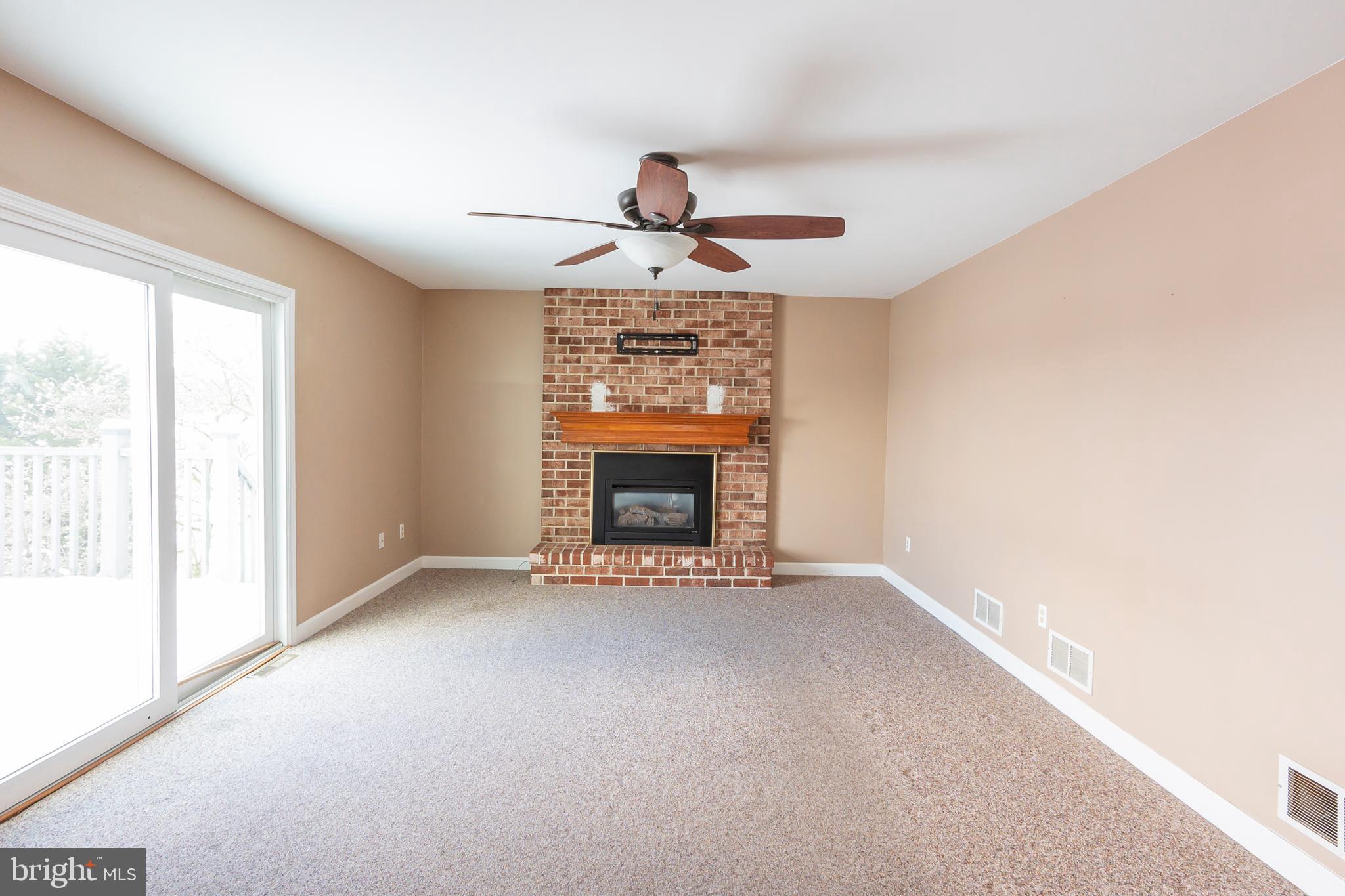 6 Overview Court Reading, PA 19607 - Photo 14 of 69 a view of an empty room with a fireplace and a window