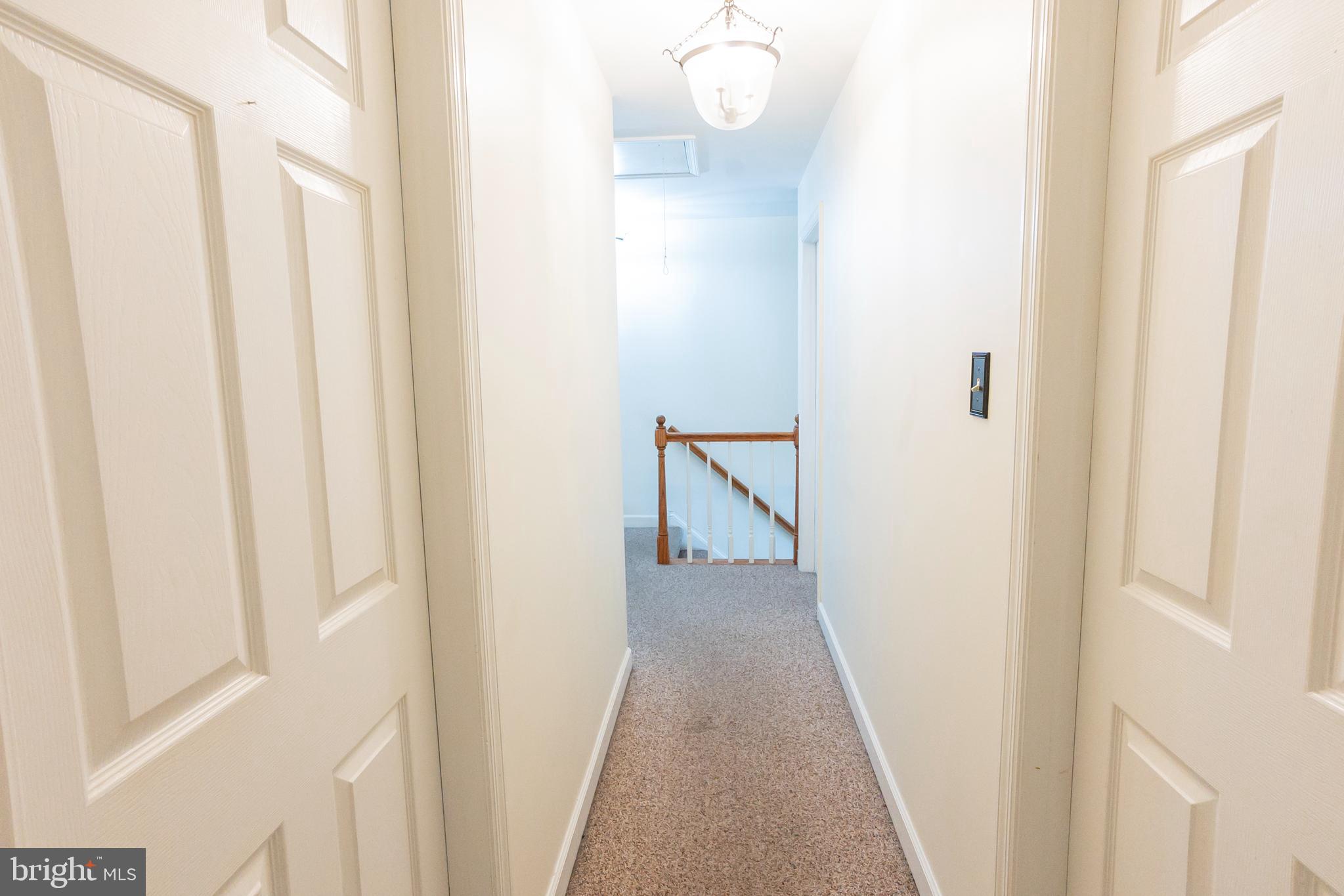 6 Overview Court Reading, PA 19607 - Photo 24 of 69 a view of a hallway with wooden floor and staircase