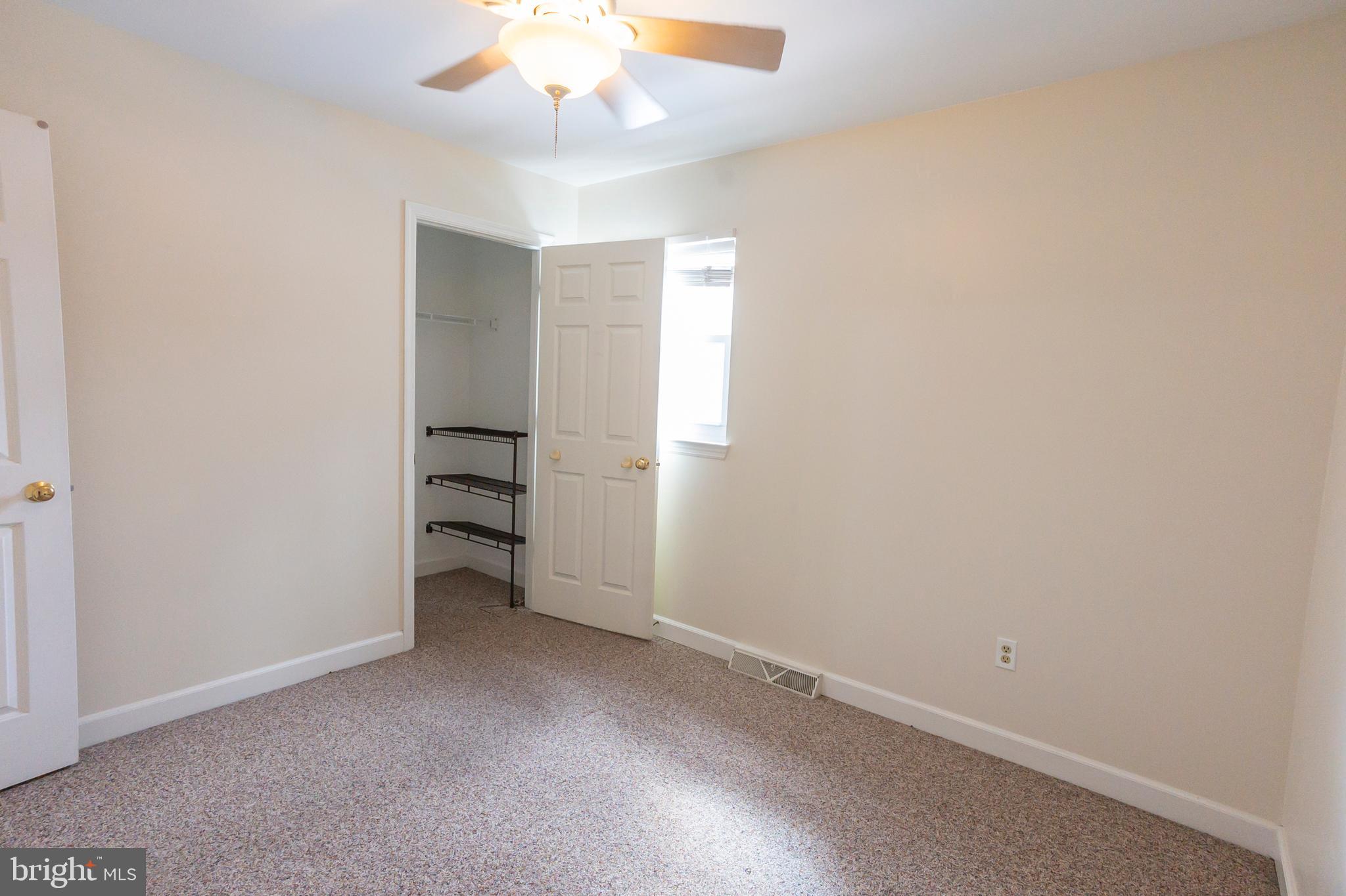 6 Overview Court Reading, PA 19607 - Photo 34 of 69 an empty room with a ceiling fan and window