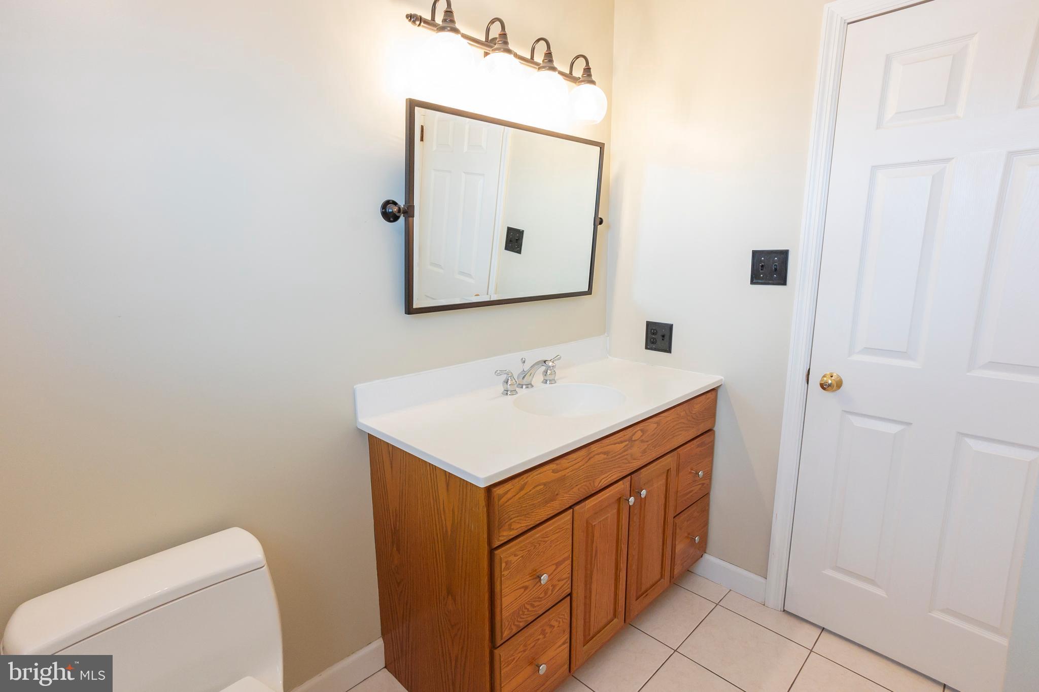 6 Overview Court Reading, PA 19607 - Photo 37 of 69 a bathroom with a sink a toilet and mirror
