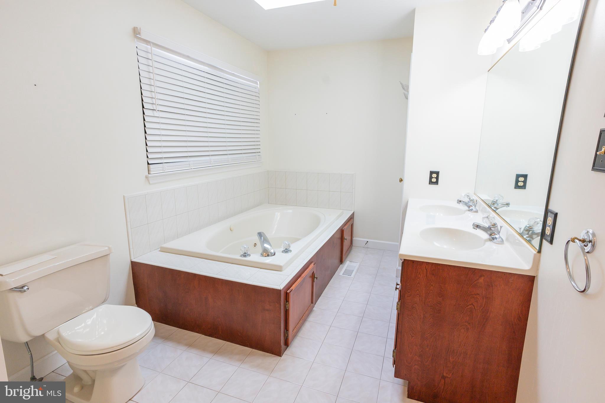 6 Overview Court Reading, PA 19607 - Photo 39 of 69 a bathroom with a sink a toilet and mirror