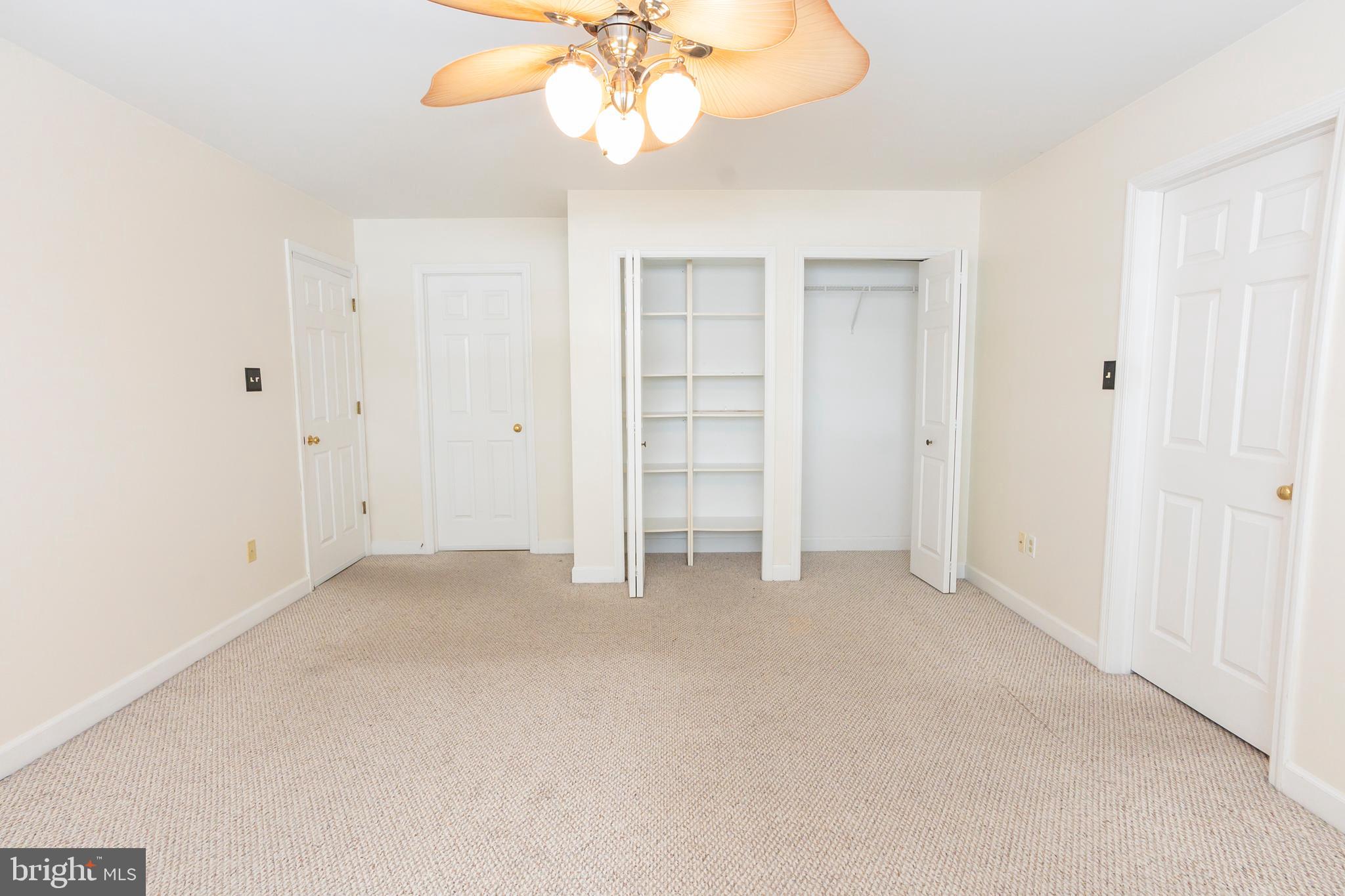 6 Overview Court Reading, PA 19607 - Photo 50 of 69 an empty room with a chandelier fan and closet