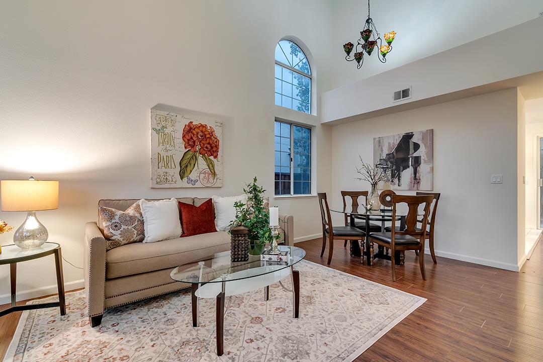 239 Balboa Drive Milpitas, CA 95035 - Photo 11 of 57 a living room with furniture a rug and a wooden floor