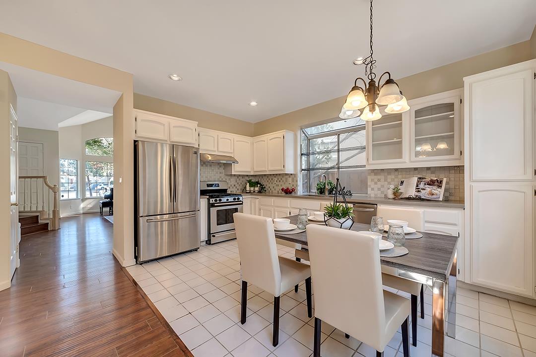 239 Balboa Drive Milpitas, CA 95035 - Photo 17 of 57 a view of a dining room and livingroom with furniture wooden floor a chandelier