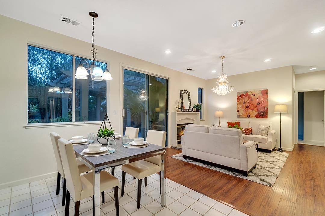 239 Balboa Drive Milpitas, CA 95035 - Photo 18 of 57 a view of a dining room and livingroom with furniture wooden floor a chandelier