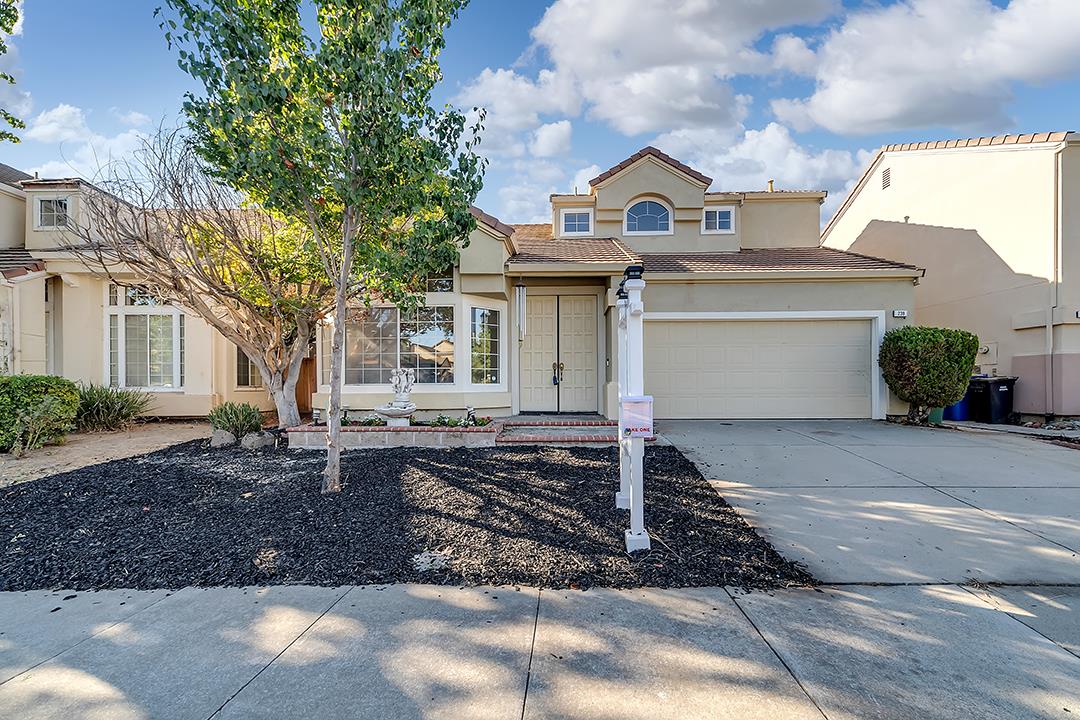 239 Balboa Drive Milpitas, CA 95035 - Photo 2 of 57 a front view of a house with a yard