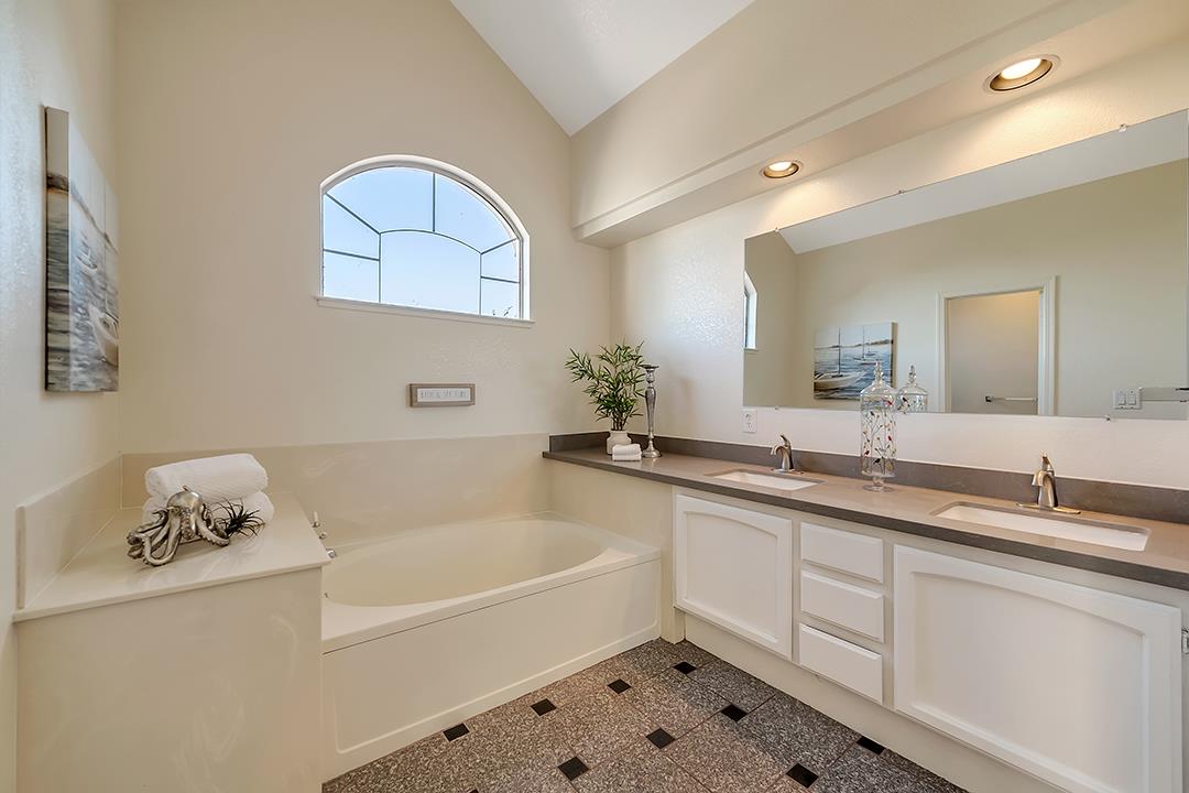 239 Balboa Drive Milpitas, CA 95035 - Photo 31 of 57 a bathroom with a tub sink and mirror