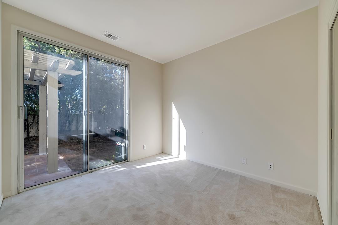 239 Balboa Drive Milpitas, CA 95035 - Photo 40 of 57 an empty room with sliding glass door and shower