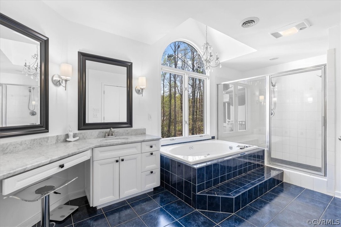 5305 Clipper Cove Road Midlothian, VA 23112 - Photo 26 of 50 a bathroom with a double vanity sink a large mirror and a bathtub
