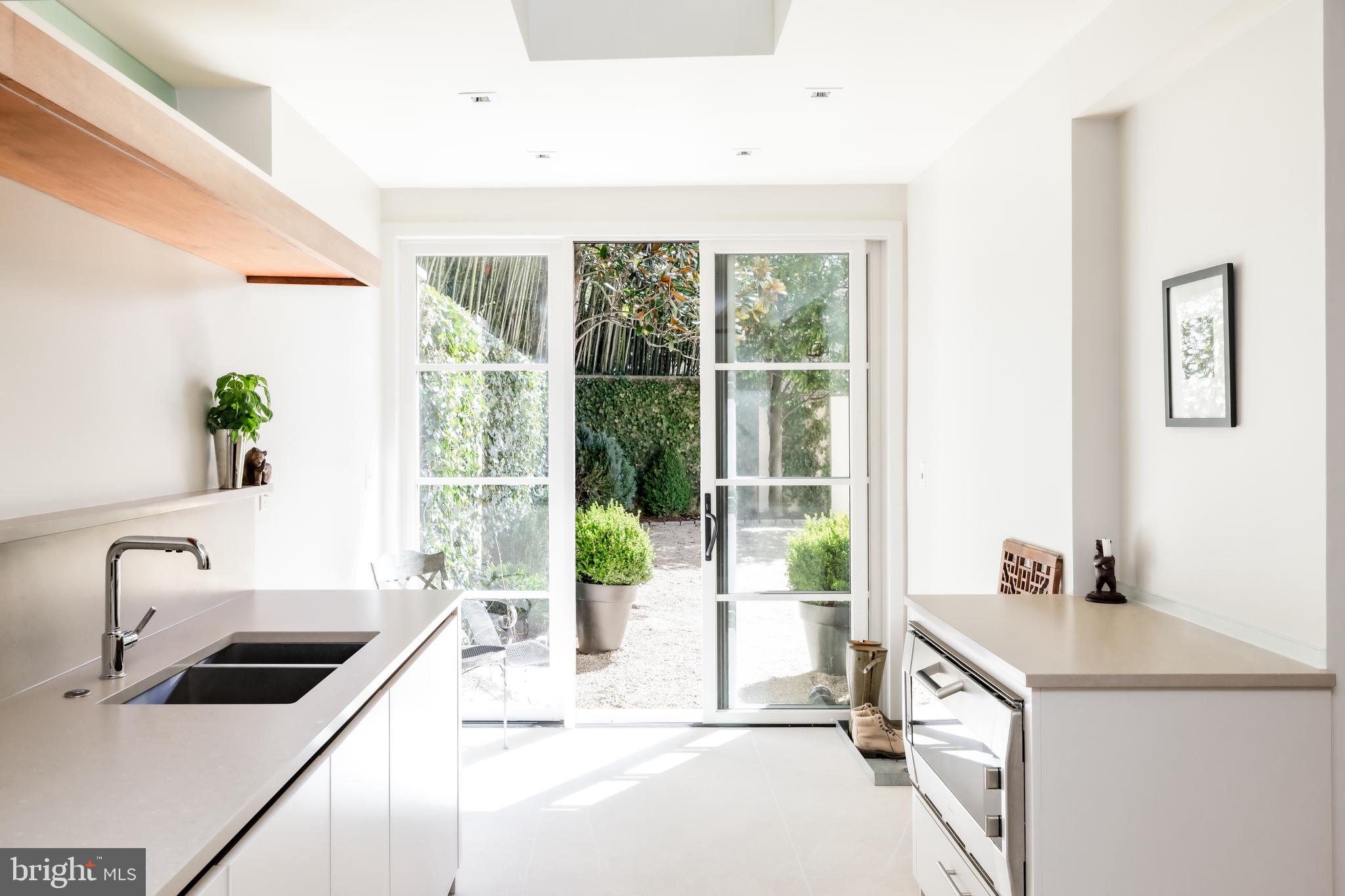 2740 Chain Bridge Road Northwest Washington, DC 20016 - Photo 12 of 50 a kitchen with a stove a sink and a refrigerator